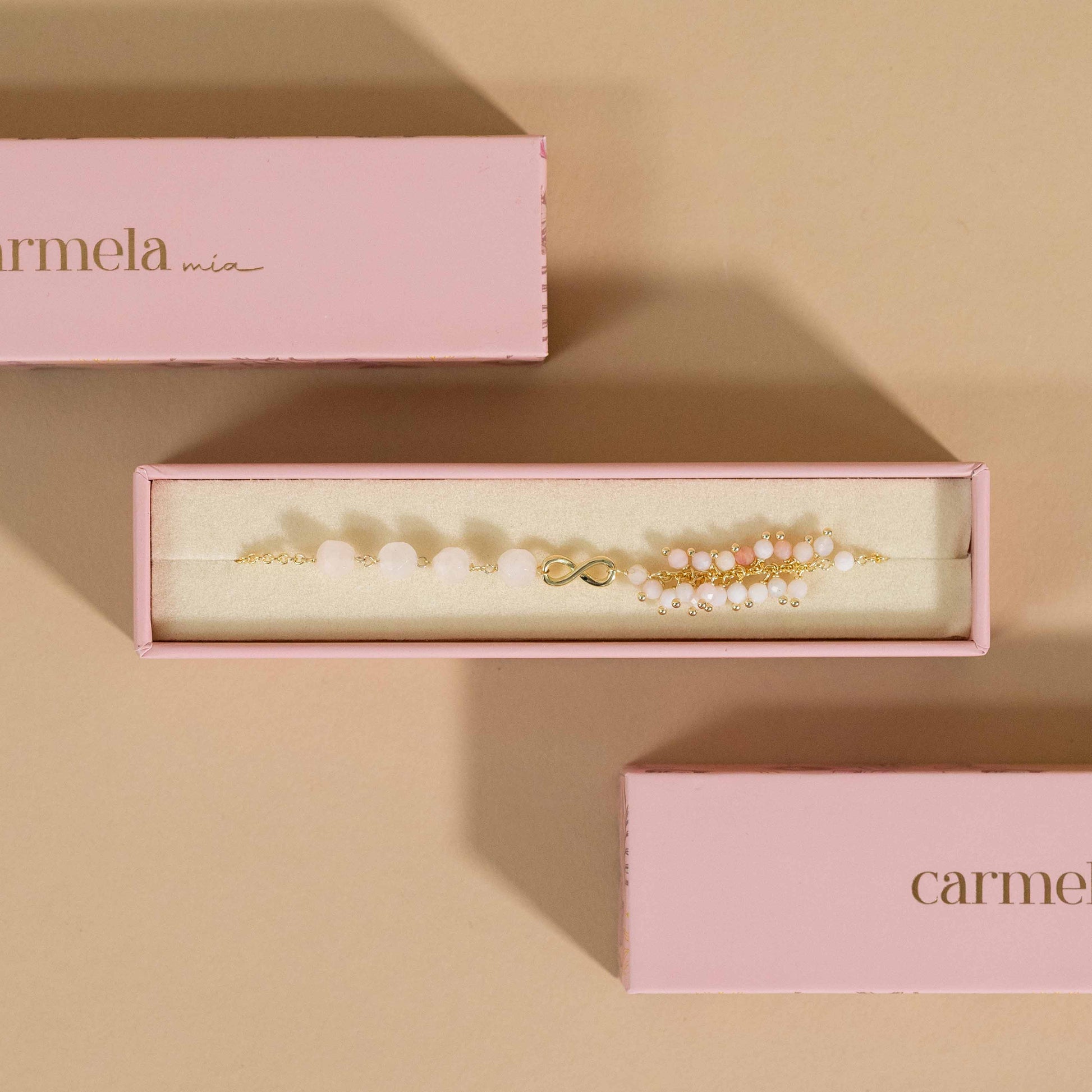 Pulsera Rosa con Símbolo de Infinito y Piedras Naturales