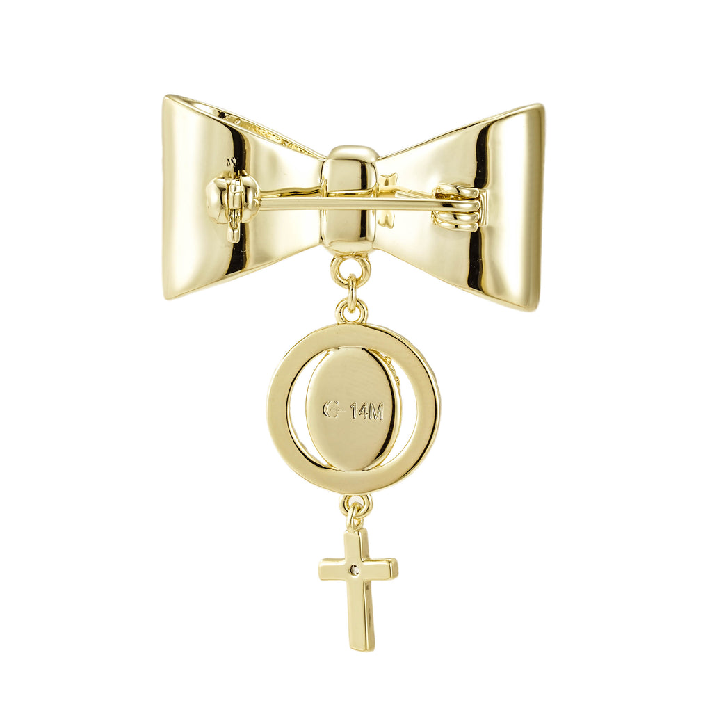 Pin de Bebé con moño y medalla de cruz.